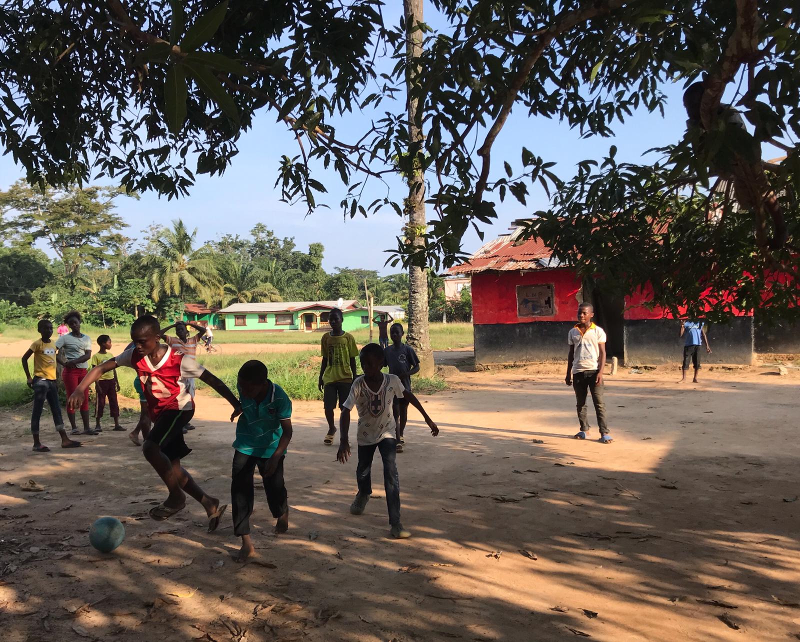 Local realities: children in Ganta, Nimba County, play football during a sunny afternoon