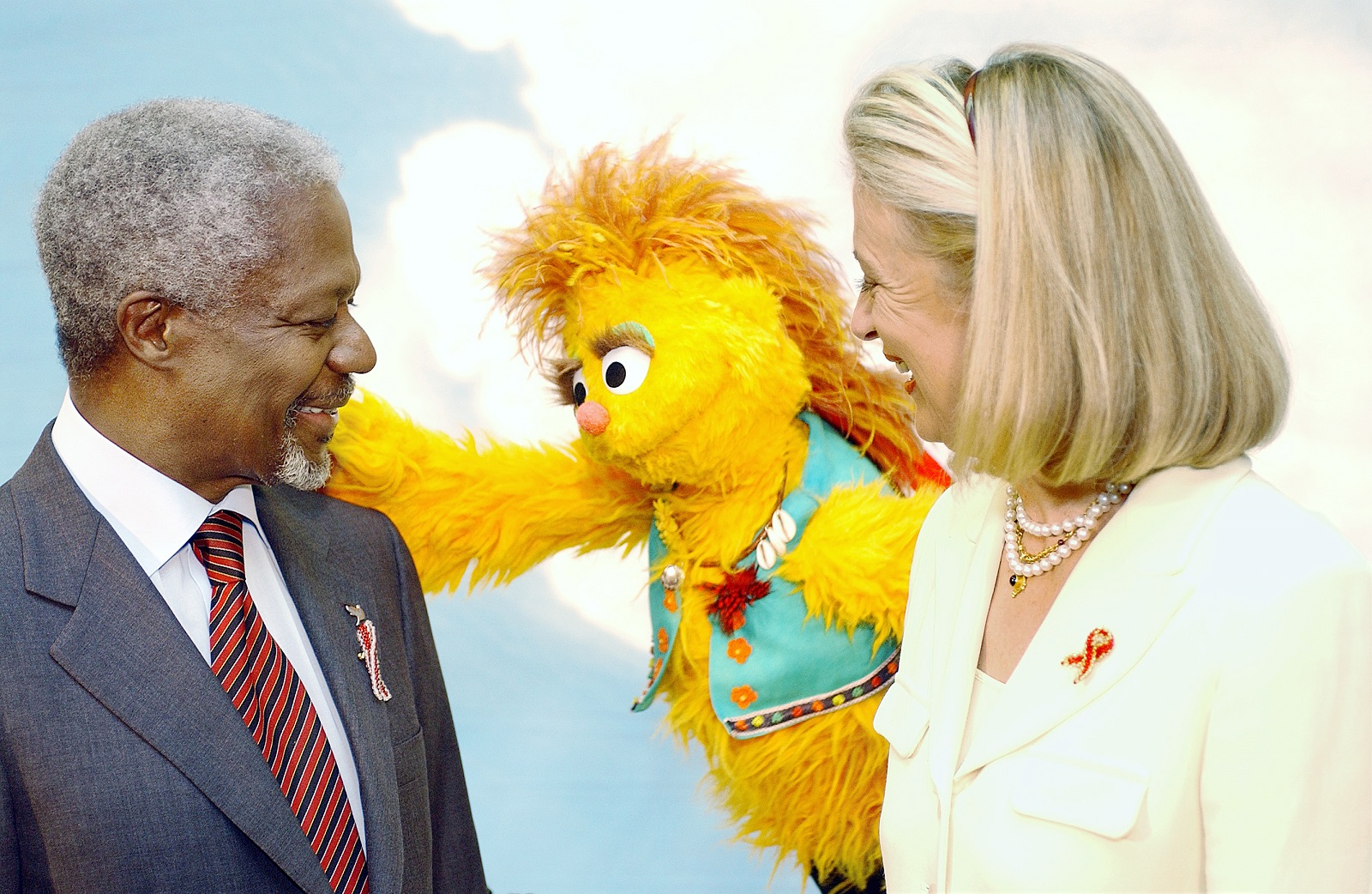 Former UN Secretary-General Kofi Annan (left) and his wife, Mrs. Nane Annan (right) pose with Kami, a HIV positive muppet on the South African version of Sesame Street whose name means acceptance in the Tswana language. Credit: UN Photo/Evan Schneider