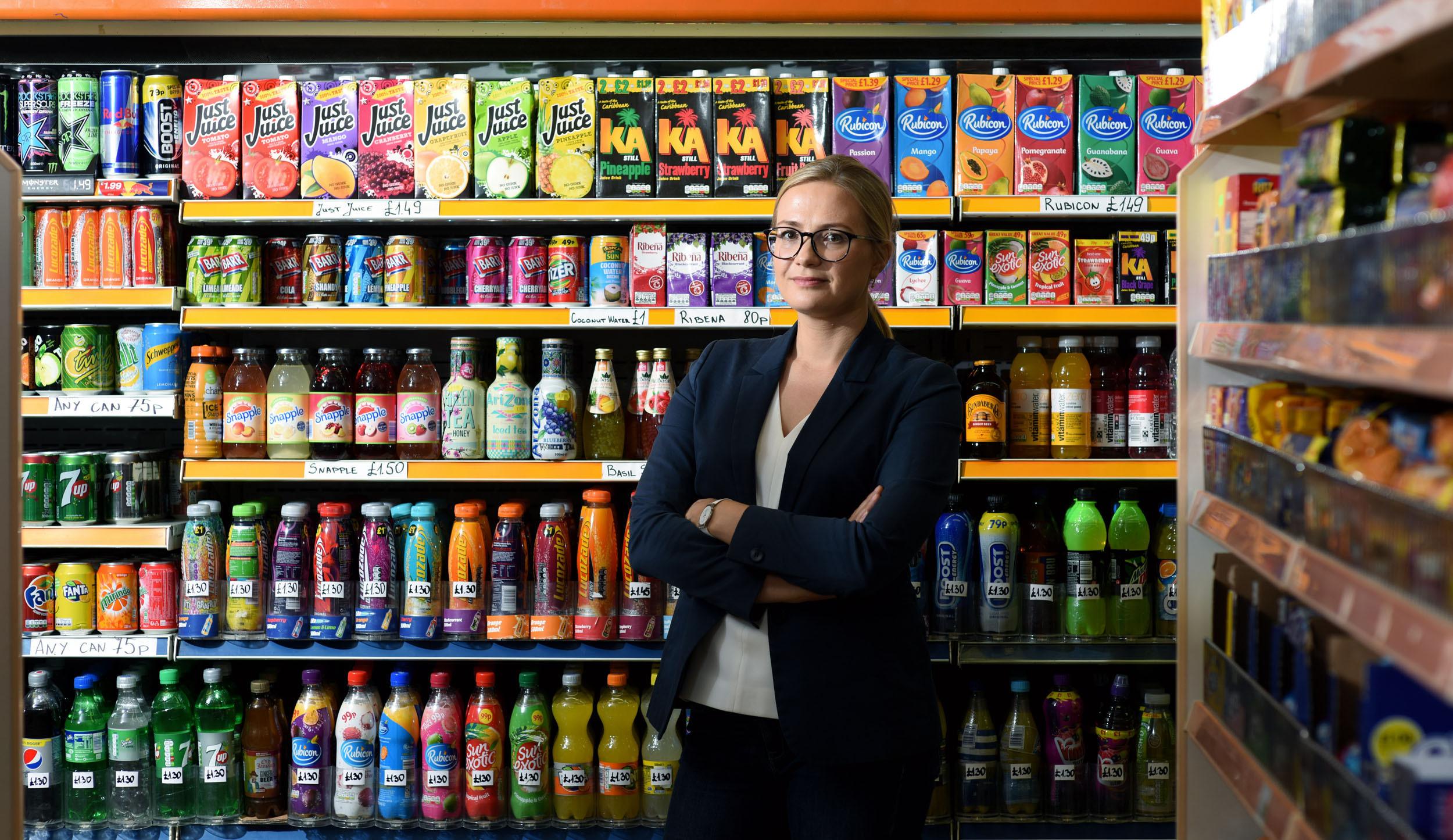 Caption: Laura Cornelsen in front of sugar snack shelves. Credit: Christian Sinibaldi