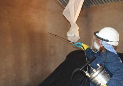 Indoor residual spraying (IRS) in a house, southern Africa © WHO