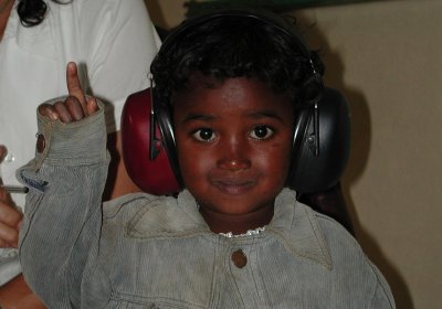 A participant in a population-based hearing survey in a low-income country has her hearing tested