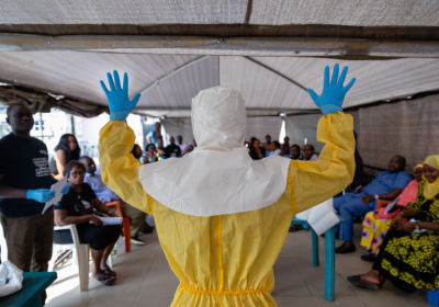 The 2014 Ebola outbreak spread across West Africa. Pictured: Abdulmajid Suleiman Musa shows a group of NCDC staff how a correctly prepared PPE suit should look when working in a virus hit region, Keffi, Nasarawa state. Credit: Louis Leeson/LSHTM