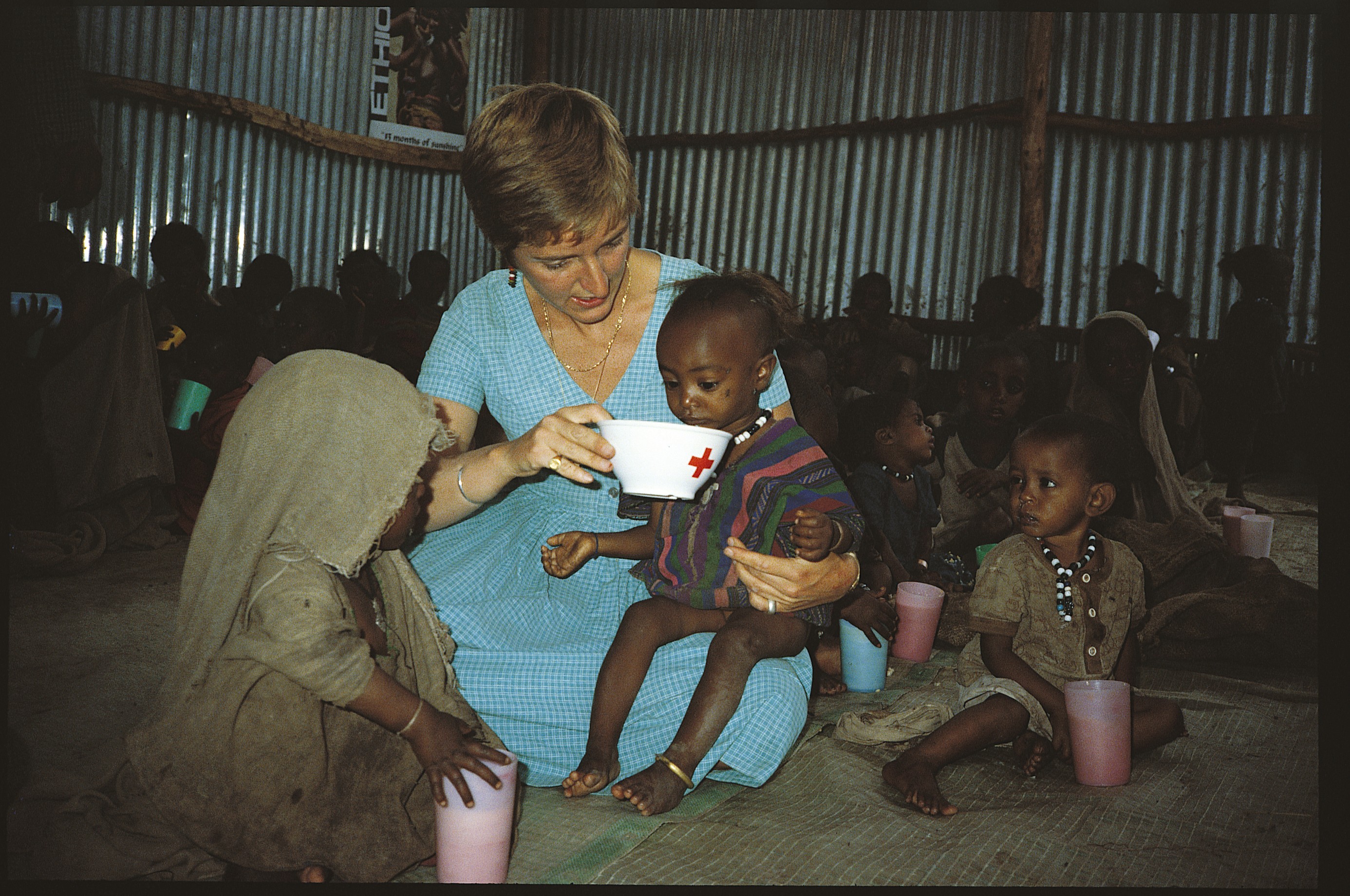 Caption: Claire Bertschinger feeding Ethiopian child. Credit: Claire Bertschinger
