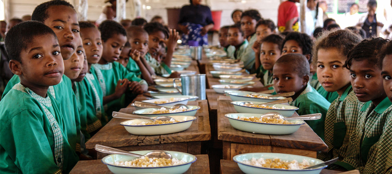 Primary school students in Madagascar enjoy their school lunch. Credit: WFP/Anna Yla Kauttu