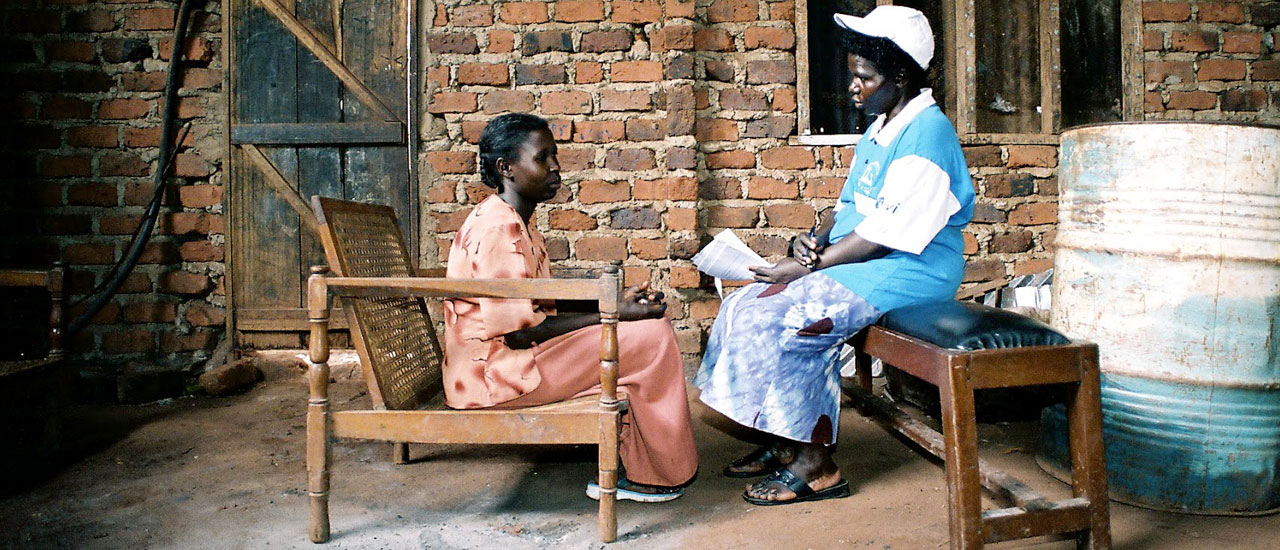 Healthcare worker interviews community member on impact of HIV in their community. Credit © 2008 Frederic Courbet for International AIDS Vaccine Initiative (IAVI)