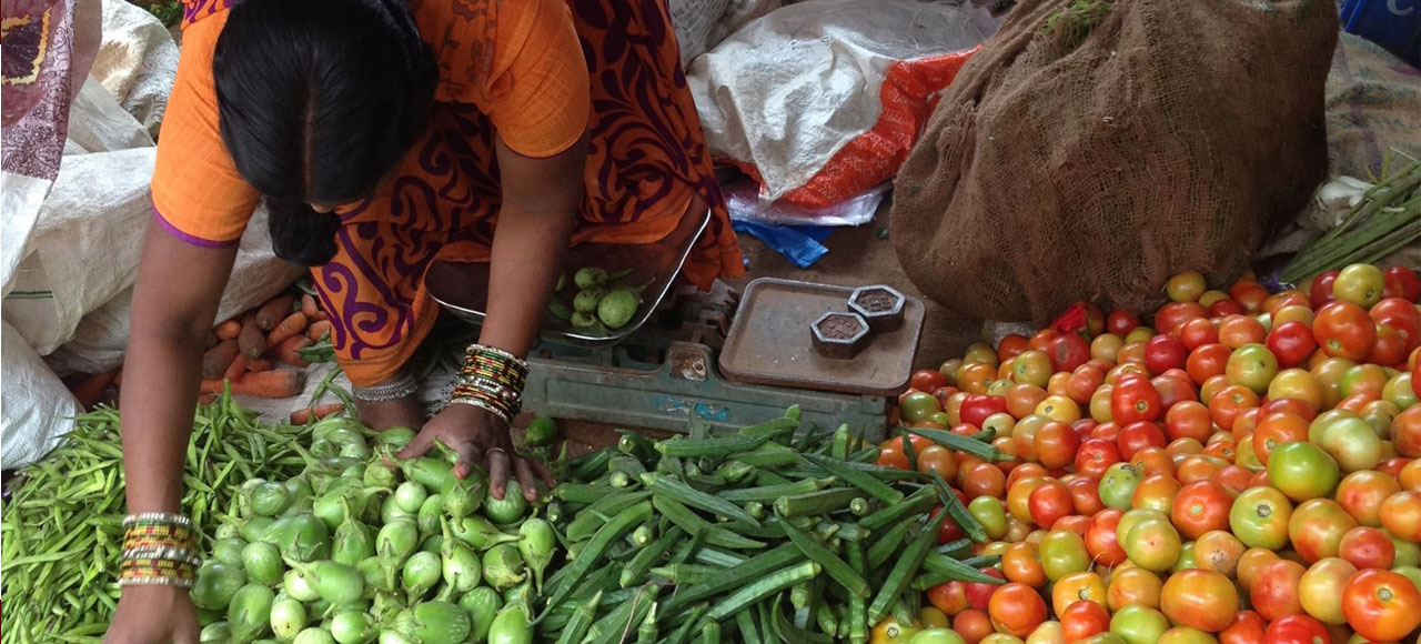Woman selling vegetables in a local market