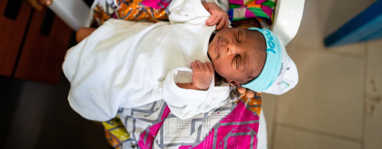 A small baby before receiving his vaccinations, Serekunda, The Gambia. Credit: Louis Leeson/LSHTM