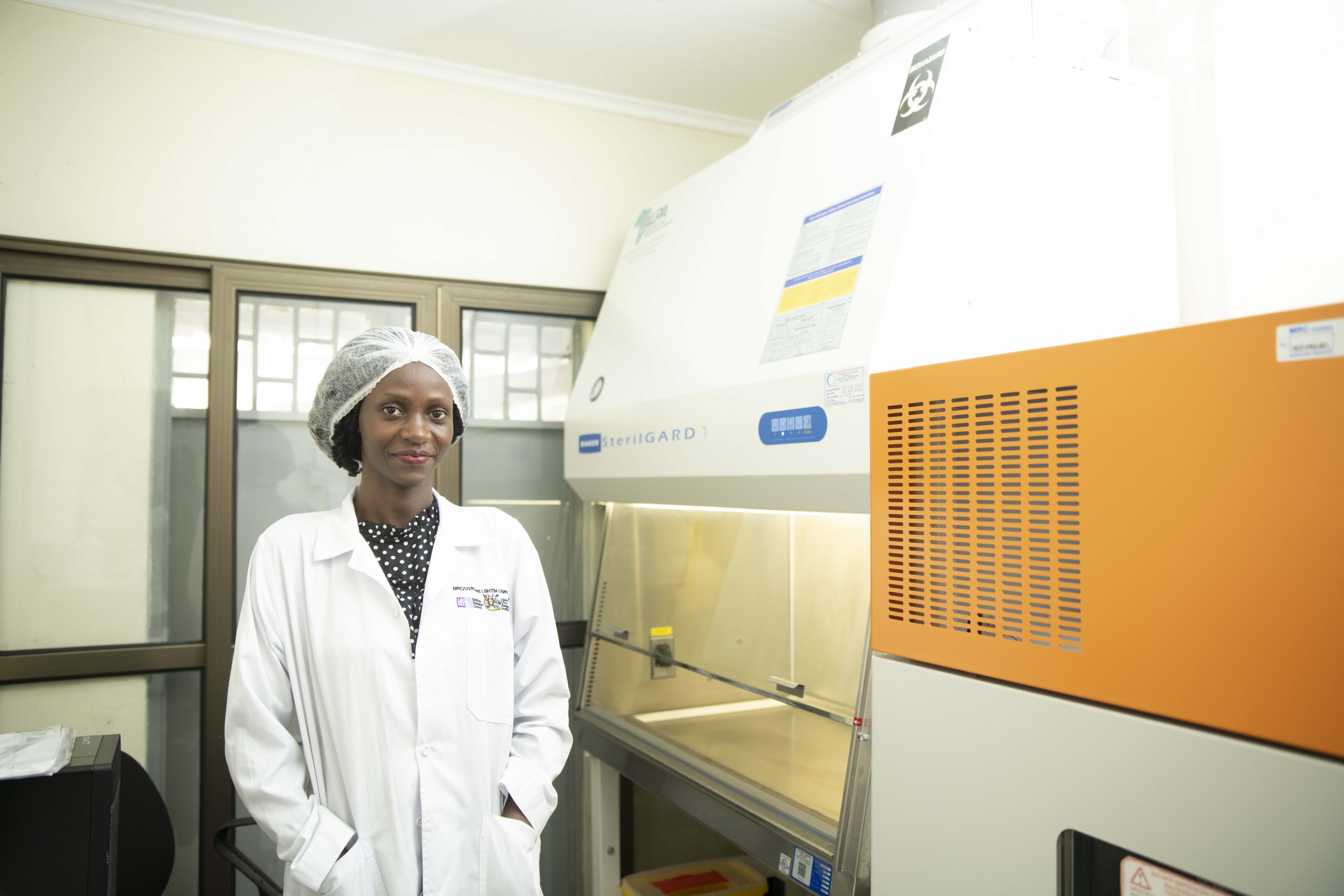 A pharmacist looking smiling at the camera