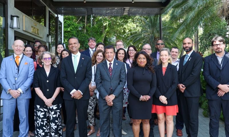 Group of people standing in a group for photo, including Trinidad and Tobago Minister of Health