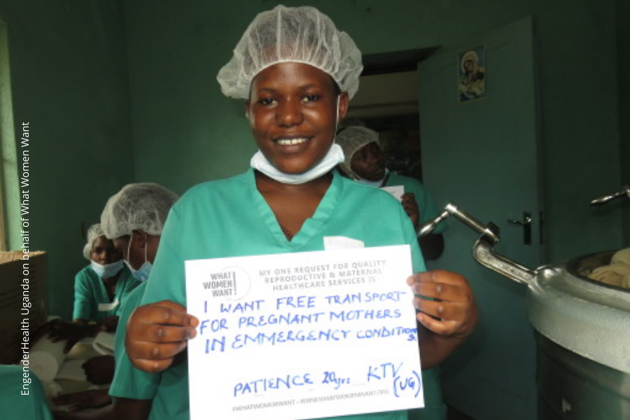 A ugandan healthcare professional wearing scrubs and PPE is holding a sign that says, 'I want free transport for pregnant mothers in emergency conditions'