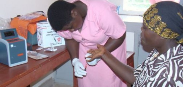 Midwife draws blood to establish HIV levels