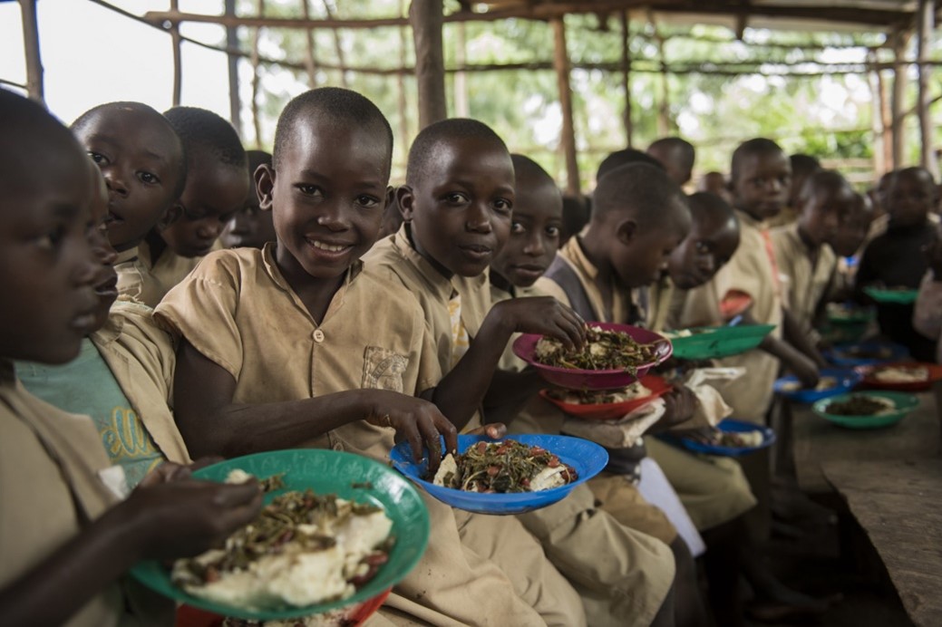 Children eating lunch at a primary school in Burundi. Credit: WFP/Hugh Rutherford