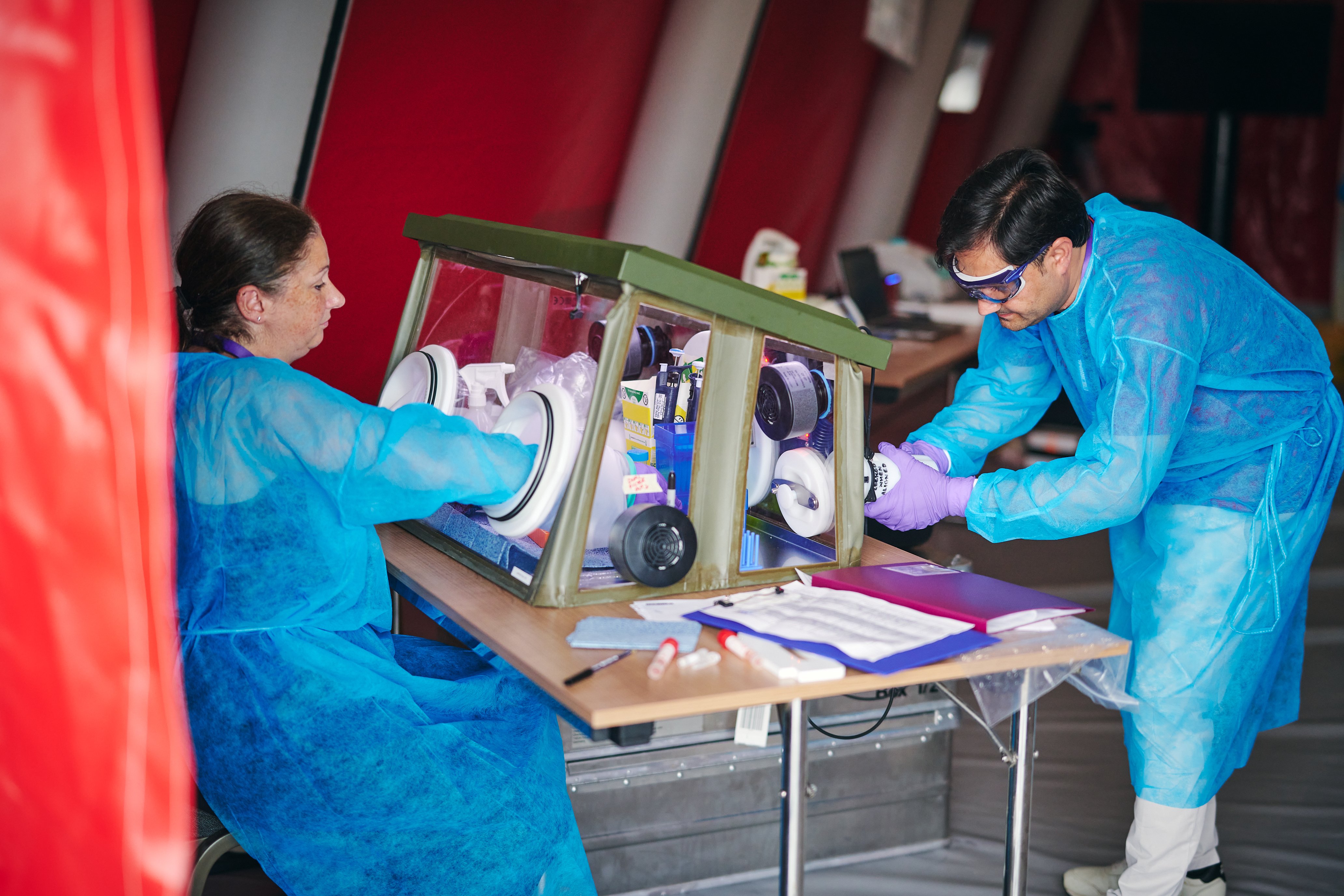 UK-PHRST Microbiology team working using RRML module in tent.