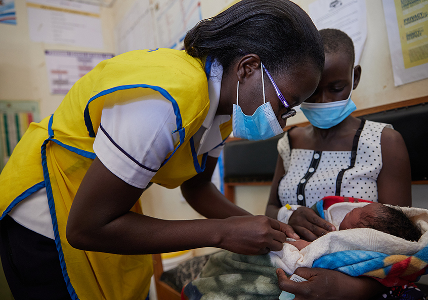 Nursing Officer Emily Obuya administers a vaccine at the Ahero County Hospital in Kisumu, Kenya in 2021. CREDIT: Gavi