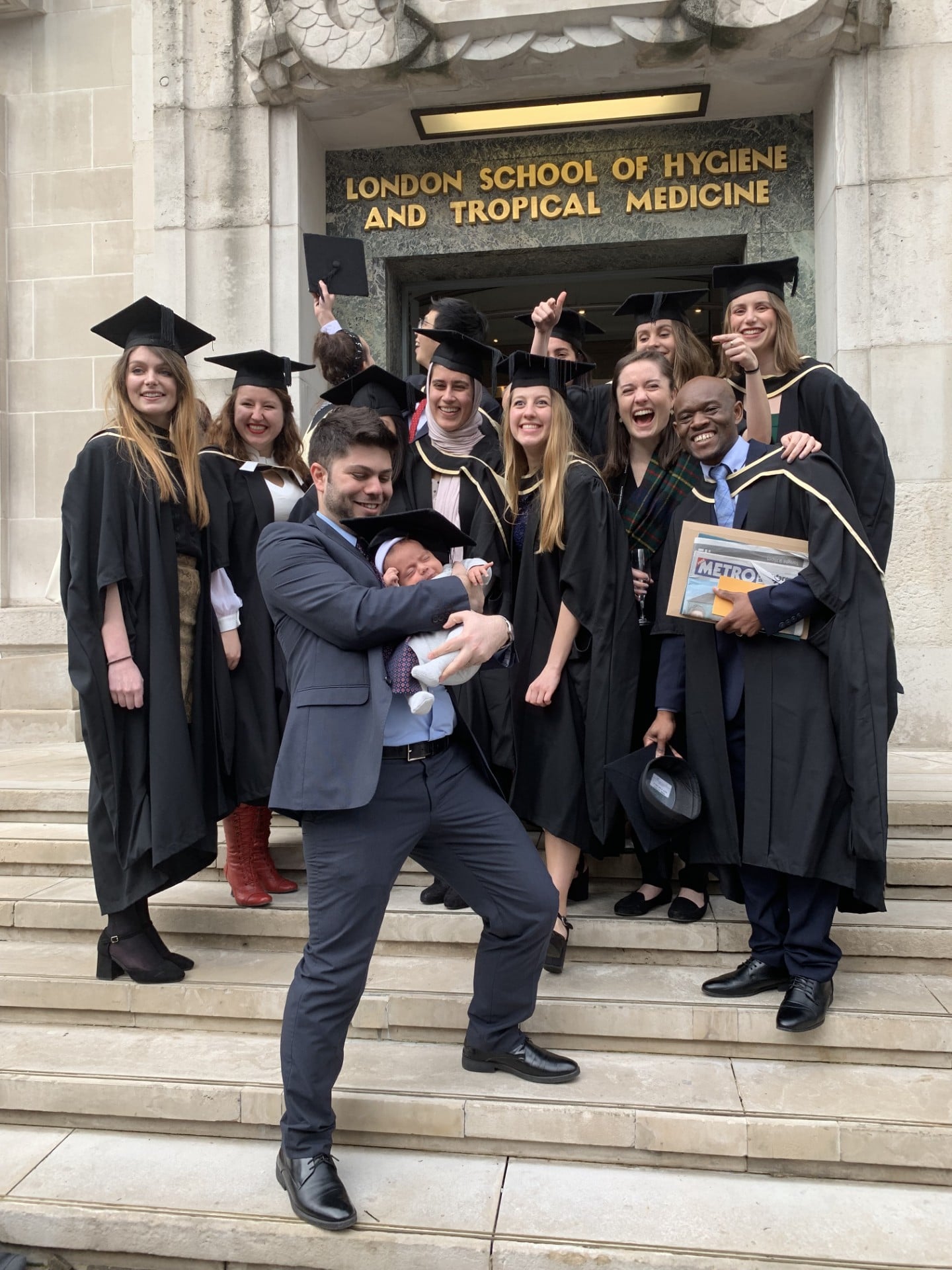 Group of graduates on the steps of LSHTM
