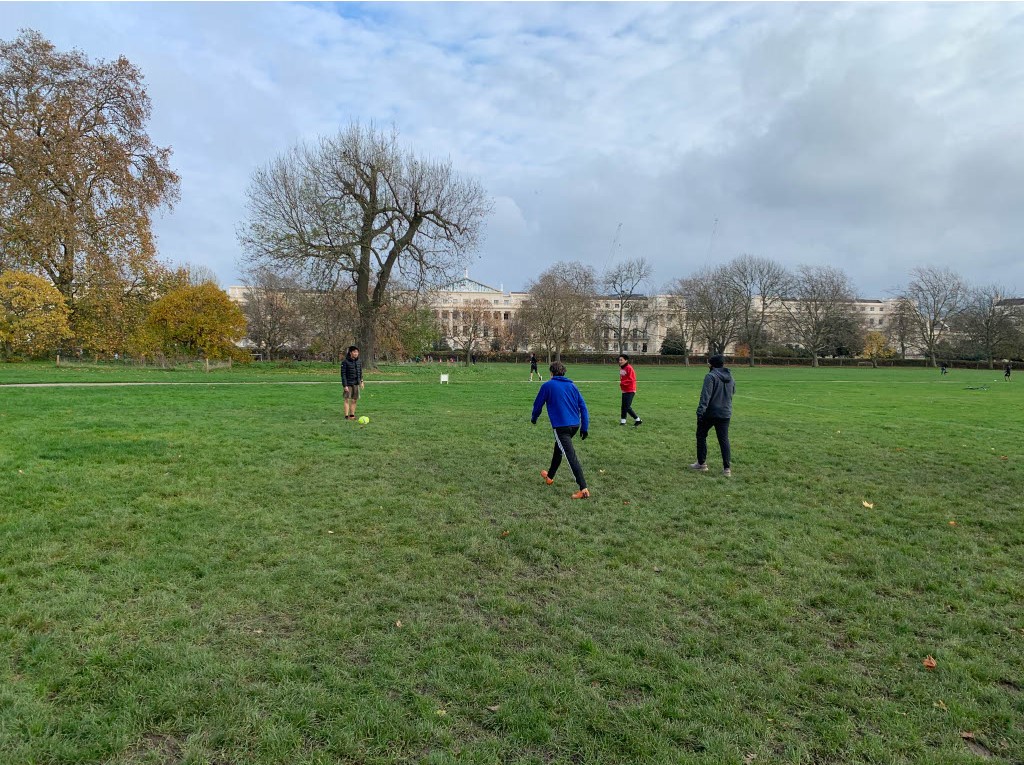 People playing football in Regent's Park, photo by Annalise Morelock.