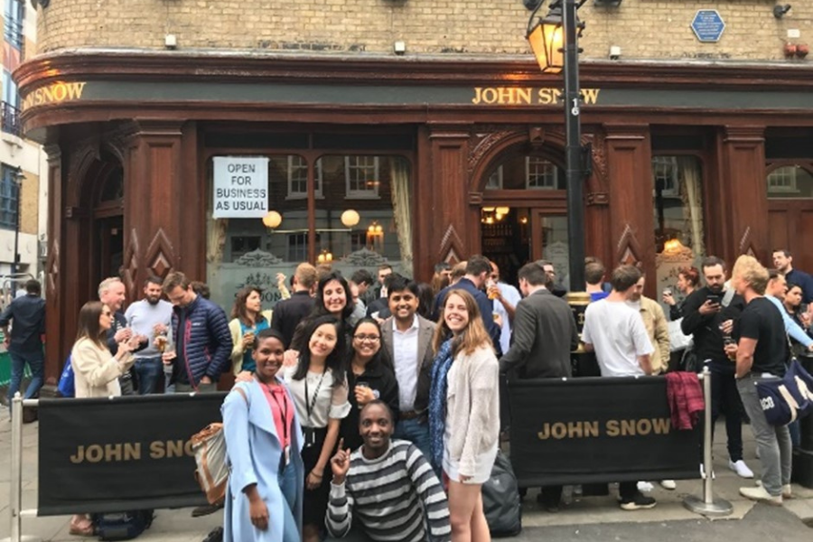 Ritu with a group of fellow students stood outside of the John Snow pub
