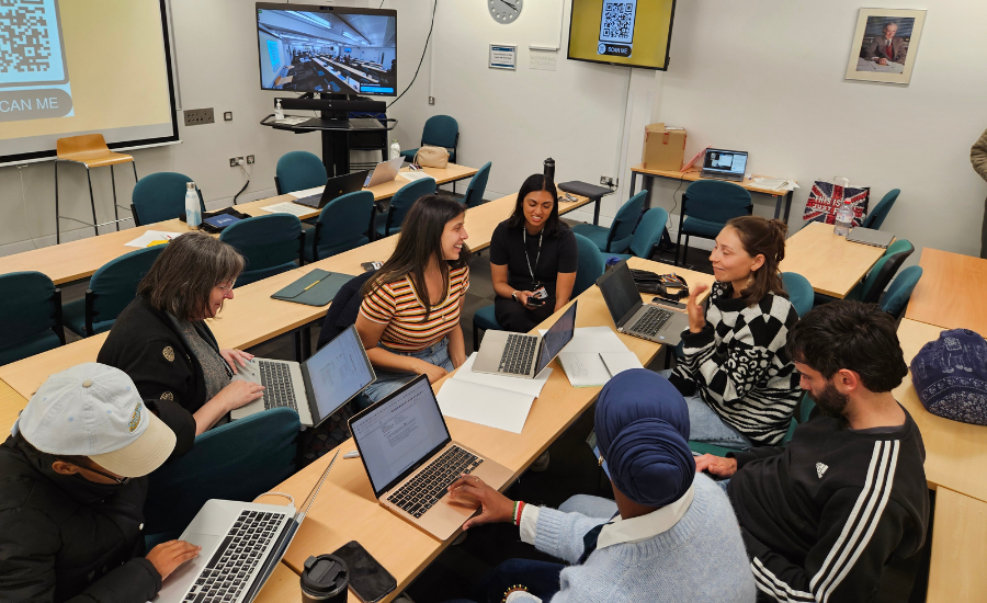 A group of students discussing in a classroom.