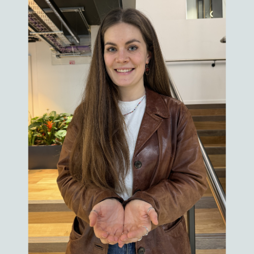 A student with Give to Gain hand gesture