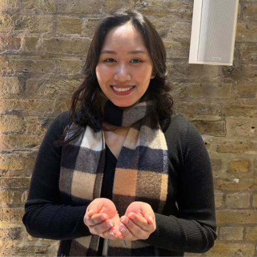 A student with Give to Gain hand gesture