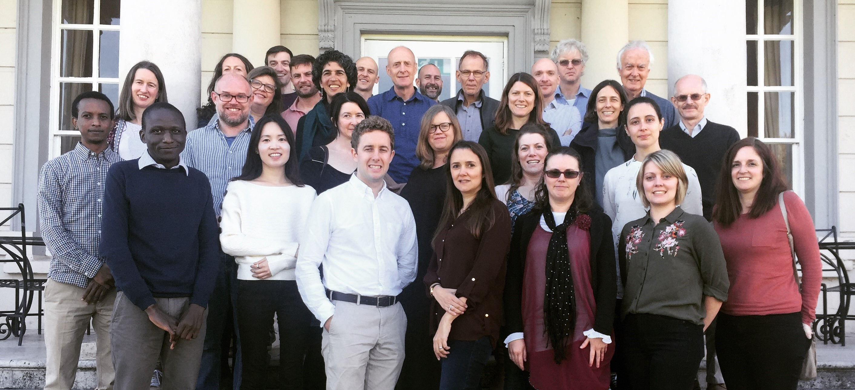 image of tropical epidemiology group on steps at annual retreat in 2018