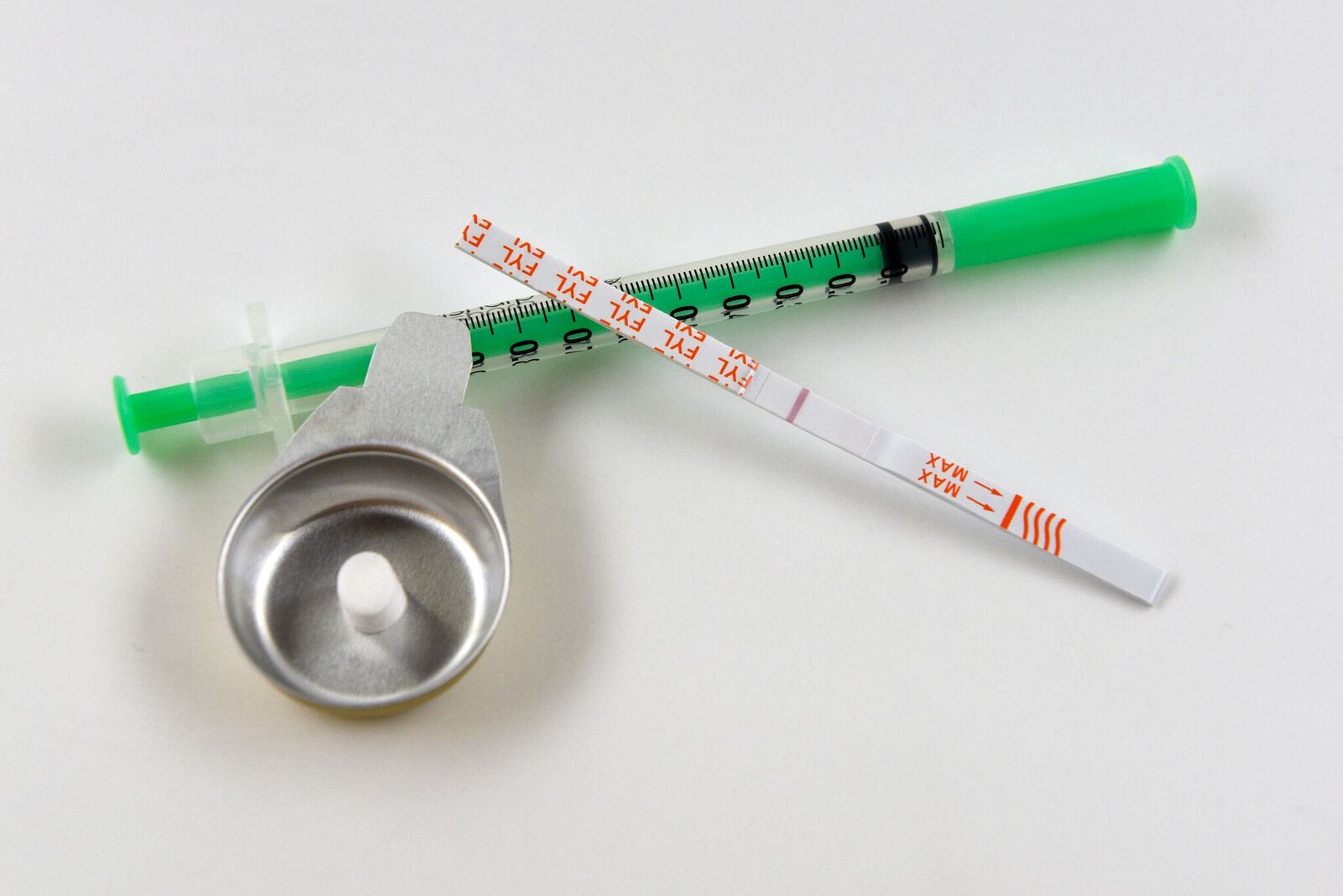Caption: Test strip_needle and spoon and filter_postive for fentanyl. Credit:  LSHTM/Anne Koerber