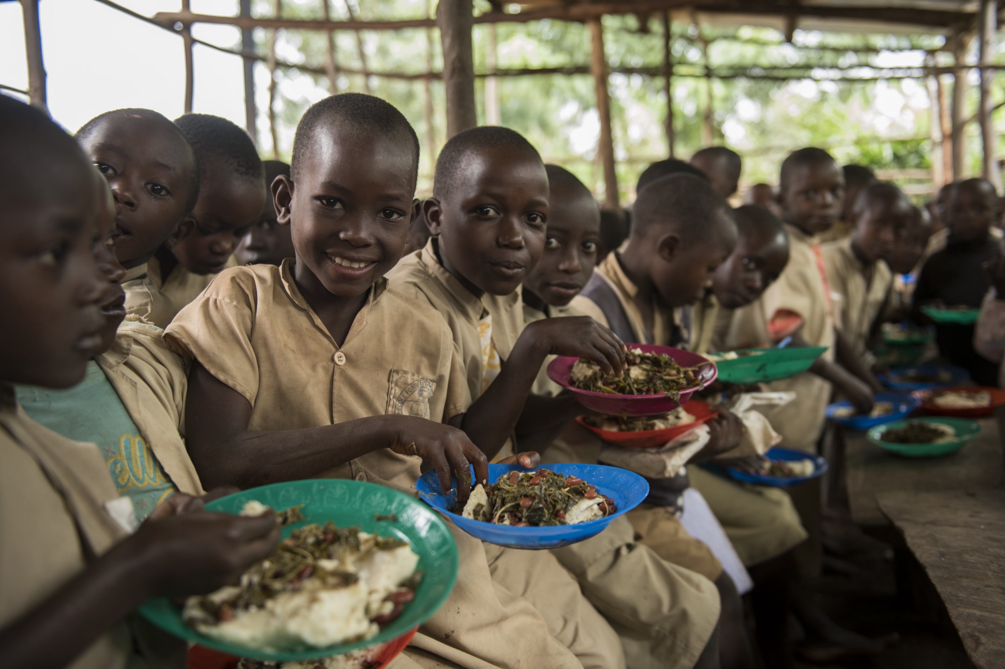 Photograph of children eating lunch at a primary school in Burundi