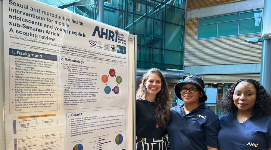 AHRI team presenting poster for Nurture4Youth at the AHRI Wellcome Trust Board of Governors meeting.