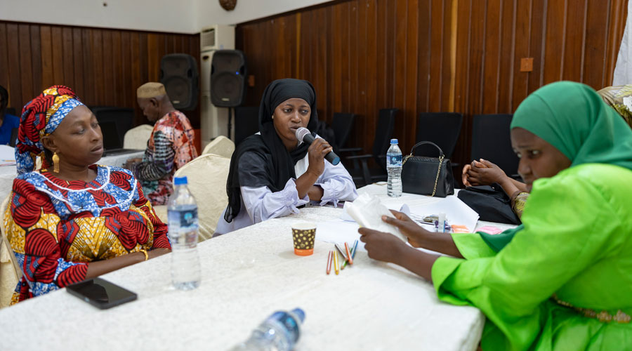A participant performs a song she has created about the environment.