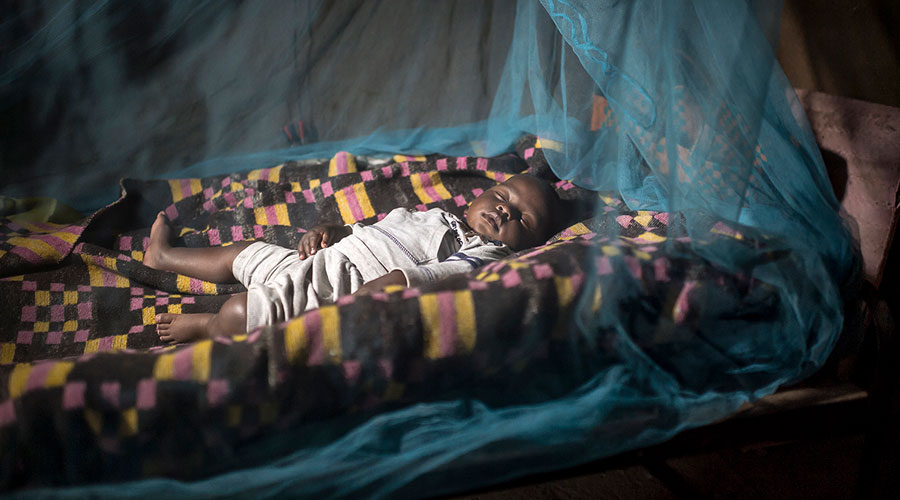 Child sleeping under insecticide-treated net 