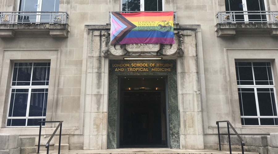 Entrance of LSHTM Keppel Street with LGBTQ+ flag above entrance