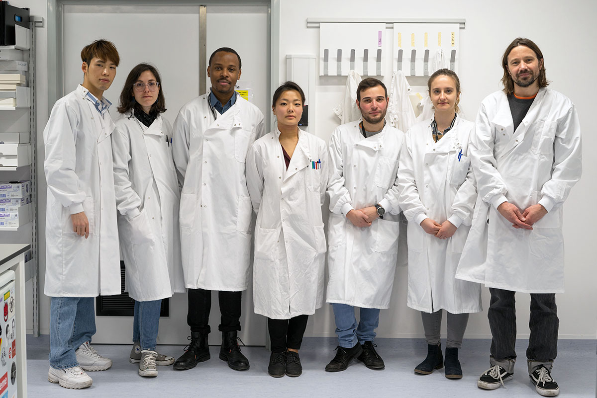 Researchers in the Mostowy lab with tanks containing TRANAC adult zebrafish