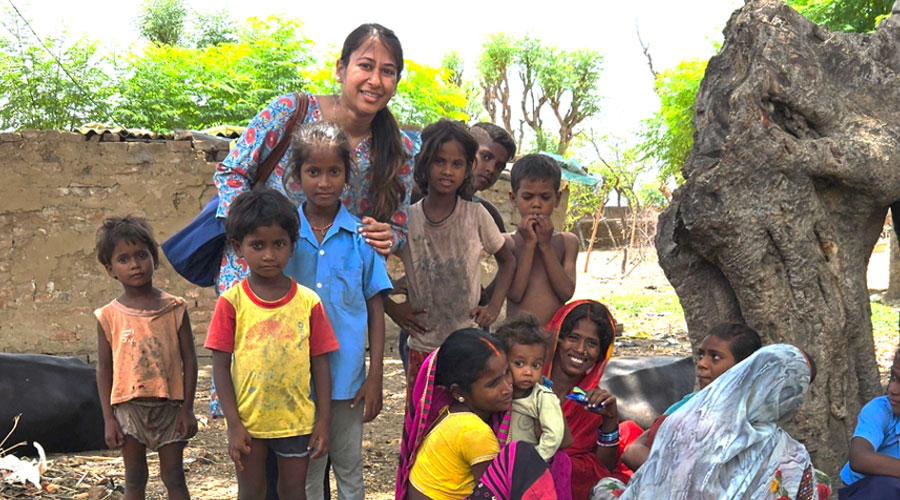 Aakriti Gupta with a group of children, collecting recipes in rural India