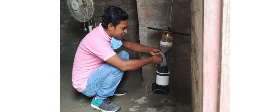 PHEG Field technician collecting insects from a light trap as part of a project using xenomonitoring to improve surveillane and control of visceral leishmaniasis in India. 