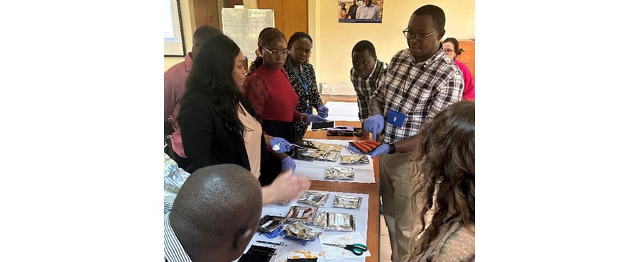 : Project team handling sugar baits at kick-off meeting of a project investigating knowledge gaps around attractive targeted sugar baits (ATSBs), Kisumu, Kenya, January 2025.