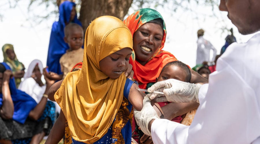 Health worker Mowlid, 28, vaccinates Imran, 4, at a mobile outreach session in a remote community in Somali Region, Ethiopia.