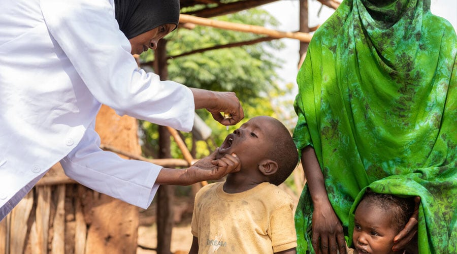 Aboyi, 4, receives an oral polio vaccine during an immunisation campaign in a remote community in Oromia Region, Ethiopia.