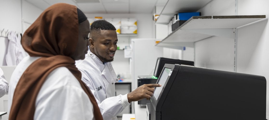 Two lab researchers working together in a laboratory