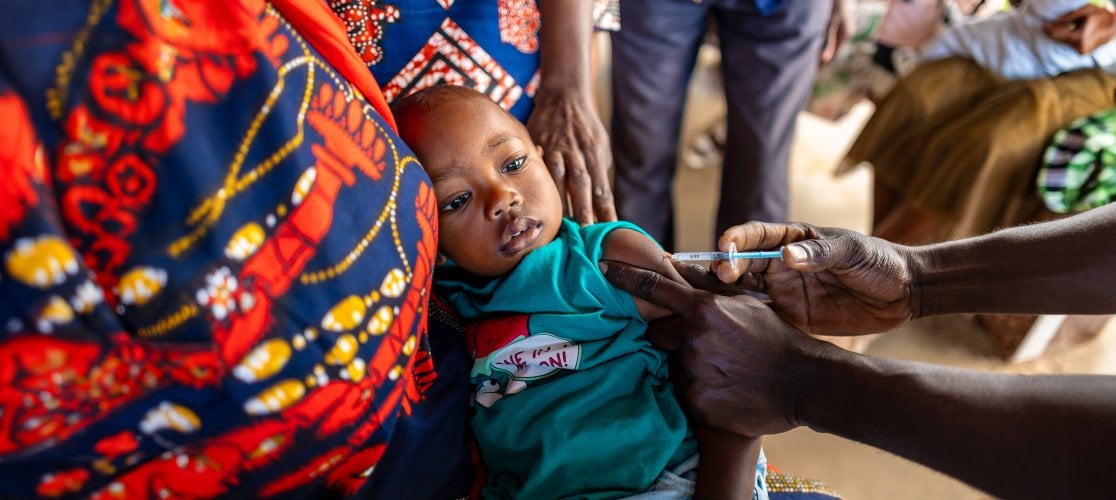 A child being vaccinated in a clinic at Fajikunda 