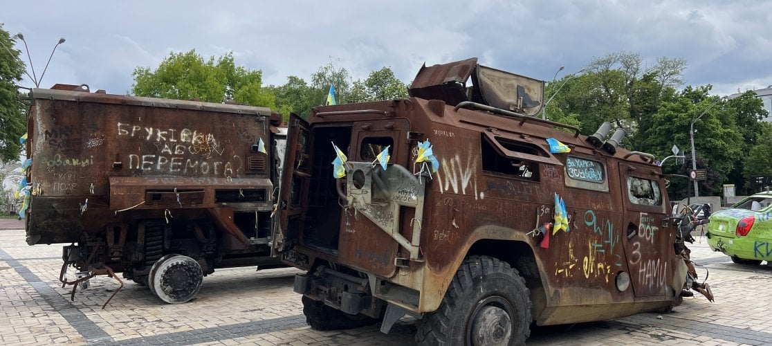 Two armoured vehicles with Ukrainian flags attached