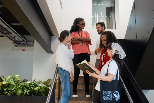Student talking on the steps of Education Centre