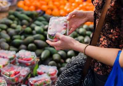 Woman shopping at fruit and vegetable market. Credit: Canva