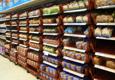 loaves of packaged bread on British supermarket shelves