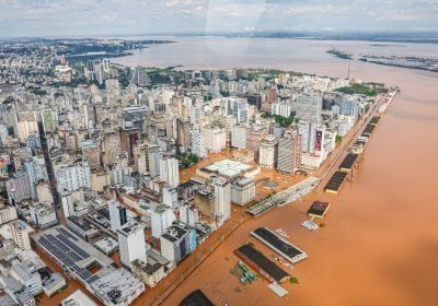Aerial view of a high-ride city flooded with orange water