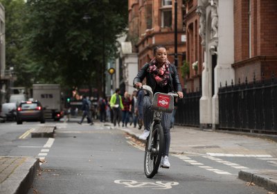 Lady cycling in London