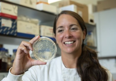 A Scientist holding a petri dish