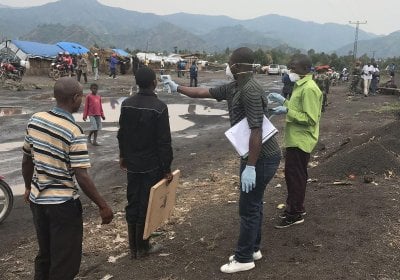 Here, in this August 2019 image, screeners use an infrared thermometer to look for signs of fever in travelers in Mubambiro, near the city of Goma, Democratic Republic of the Congo (DRC). A fever is one of the symptoms of Ebola virus disease, which Congolese and international health agencies have been battling for a year in the DRC.