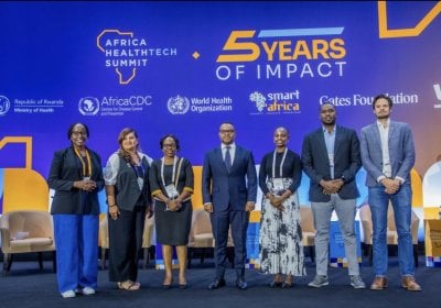 Dr Elizabeth Wangari Mwanika is photographed in a conference space with several other speakers for the 2026 Africa HealthTech Summit