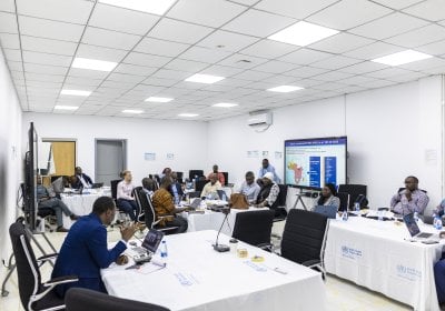 Individuals having discussions in a seminar room