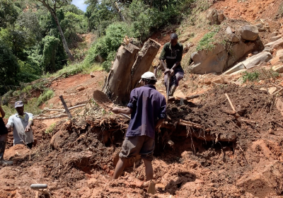 Residents searching for a victim after Cyclone Idai triggered a landslide in Chimanimani District, Zimbabwe.